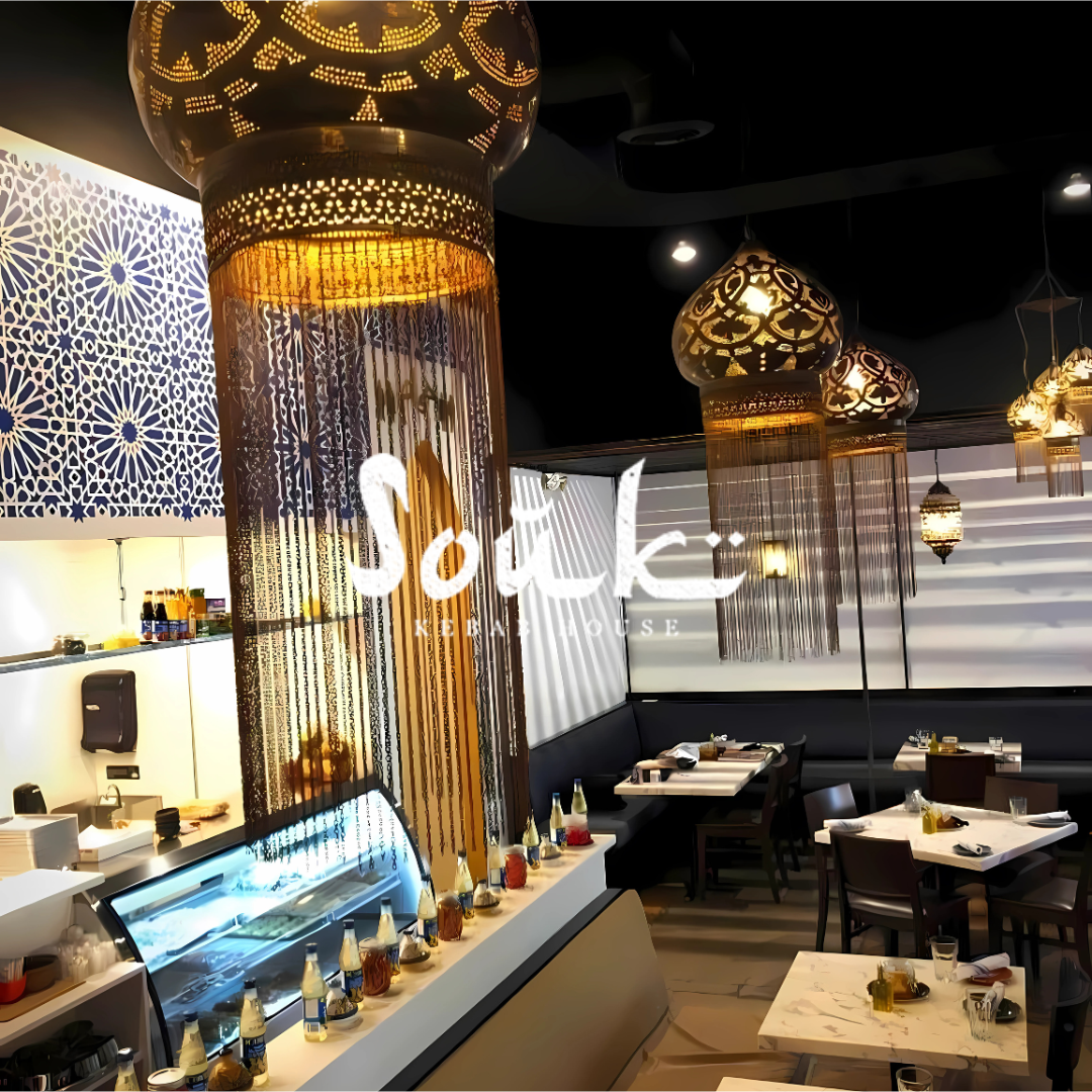 Moroccan-inspired interior of Souk Mediterranean Bistro with ornate lantern lighting and tiled kitchen counter.