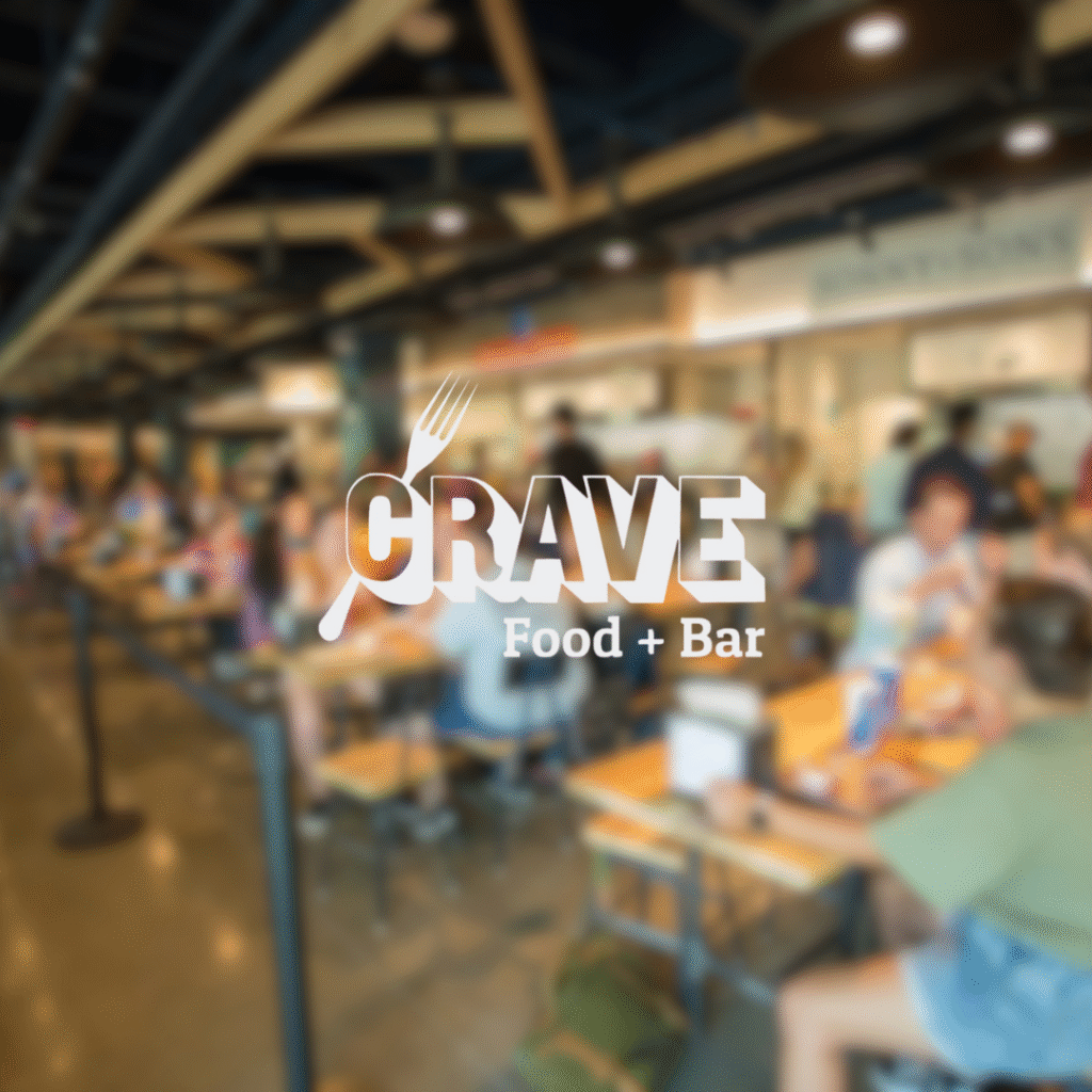 Crave Food Hall logo overlay on bustling dining area