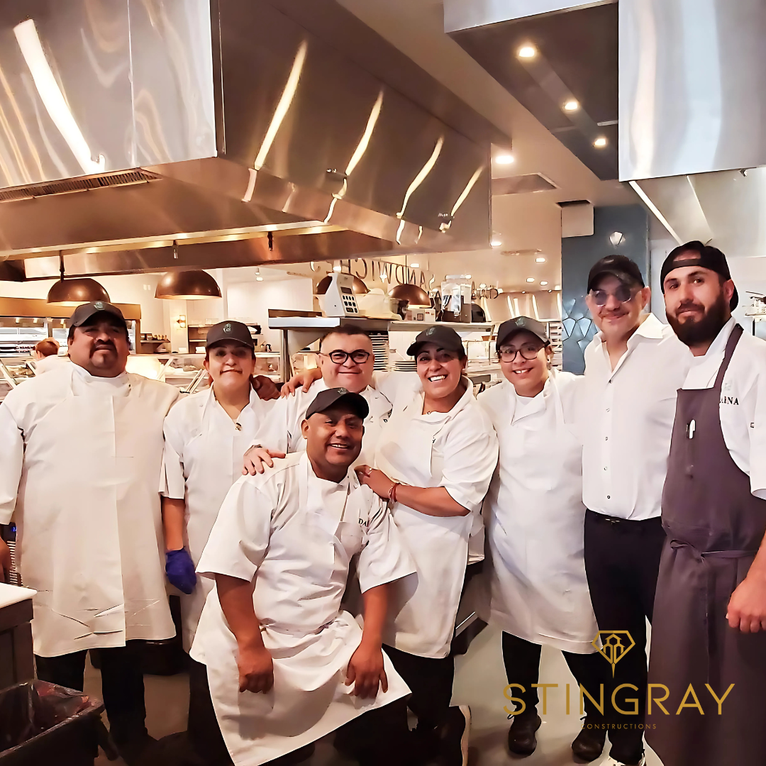 Group photo of Darna chefs and kitchen staff in the commercial kitchen.