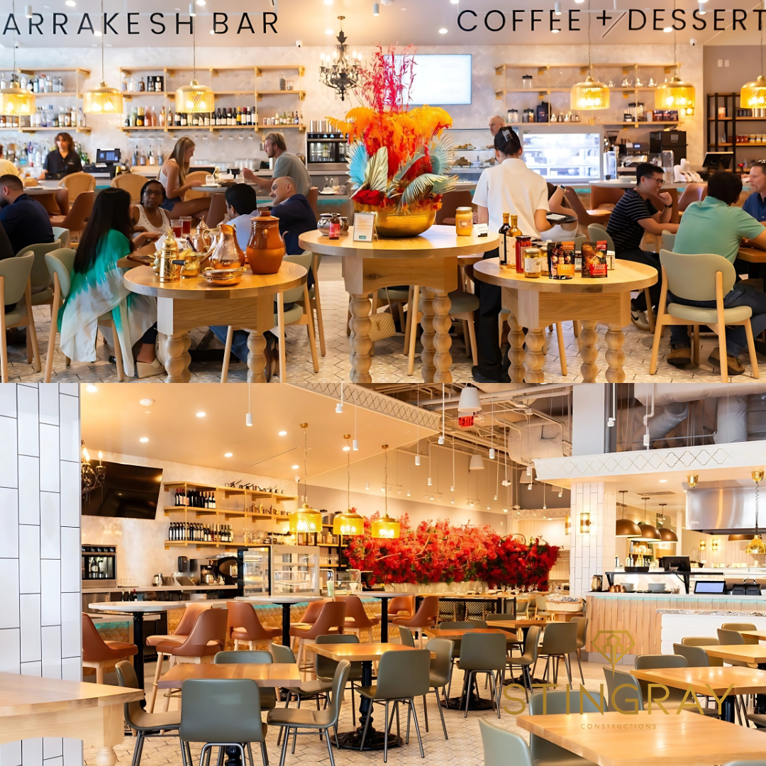 Interior of Darna Mediterranean Market with central dining tables, floral displays, and a coffee and dessert counter.